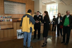 Cmdr. George Perez greeting visitors in the New Mexico History Museum lobby.