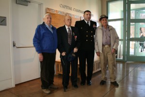 Cmdr. Perez with BB 40 veterans James Kennedy (from left), George Smith and LaVell Richins.