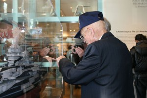 Ret. CWO George Smith pointing to the place on the BB 40 model where he was stationed during WW2.