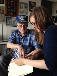 Curator Meredith Davidson interviews World War II veteran Elvert Pooler.